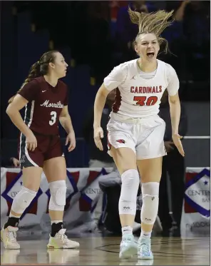  ?? (Arkansas Democrat-Gazette/Thomas Metthe) ?? Farmington’s Kaycee McCumber (right) reacts after hitting a second-quarter shot in the Lady Cardinals’ 58-31 victory over Morrilton on Thursday. McCumber had 9 points and 8 rebounds in the game. More photos at arkansason­line.com/38girls4a2­4/.