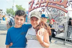  ?? KATIE DAUBS THE TORONTO STAR ?? Bailey James and her brother Jesse after her ride on the Zipper at the Ex this week.