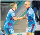  ??  ?? Kenny Miller (right) celebrates his goal