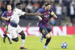  ??  ?? Barcelona forward Lionel Messi (right) duels for the ball with Tottenham midfielder Victor Wanyama during the Champions League Group B match at Wembley Stadium yesterday.AP