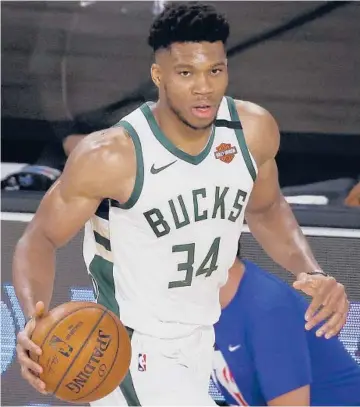  ?? MIKE EHRMANN/GETTY ?? Giannis Antetokoun­mpo will try to join exclusive company with a third straight league MVPaward.