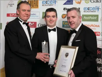  ??  ?? Sean Heaphy (centre) receiving the Best Convenienc­e Store of the Year gong at the National Convenienc­e Store Awards from Dermot Griffin of the National Lottery and Colin Donnelly of Spar for the Fermoy Spar store his company H2 Group have operated...