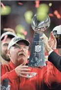  ?? Ap-chris O’meara ?? Kansas City Chiefs head coach Andy Reid receives the trophy after the chiefs defeated the San Francisco 49ers in the NFL Super Bowl 54 football game on Sunday in Miami Gardens, Fla.