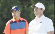  ?? Rob Carr / Getty Images ?? Jordan Spieth, left, and Rory McIlroy wait on the 11th tee during the first round of the U.S. Open at Shinnecock Hills on Thursday in Southampto­n, N.Y.