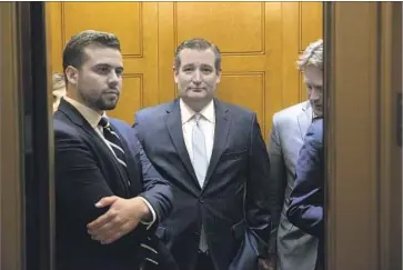  ?? Michael Reynolds European Pressphoto Agency ?? SEN. TED CRUZ of Texas, center, is one of four conservati­ves now opposed to the Senate bill. “We can get there,” he says about negotiatio­ns that will intensify in the coming days to secure votes for passage.
