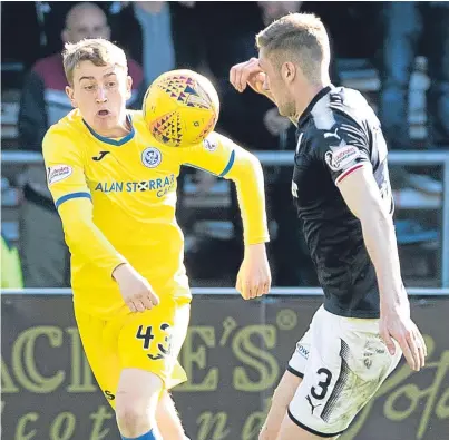  ?? Picture: Graeme Hart. ?? John Robertson comes up against Kevin Holt of Dundee.