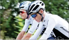  ?? — Reuters photo ?? Team Sky riders Luke Rowe of Britain and Chris Froome of Britain train.