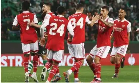  ?? Photograph: Pedro Nunes/Reuters ?? Arsenal’s players celebrate after Sporting’s Japanese Hidemasa Morita scored an equalising own goal.