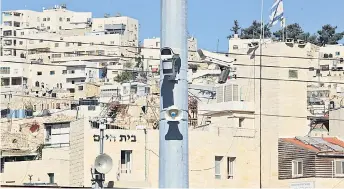  ?? — AFP ?? File photo shows a surveillan­ce camera is pictured at a checkpoint in the flashpoint Palestinia­n city of Hebron. photos