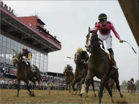  ?? STEVE HELBER - THE ASSOCIATED PRESS ?? Jockey Tyler Gaffalione, right, reacts aboard War of Will, as they crosses the finish line first to win the Preakness Stakes horse race at Pimlico Race Course, Saturday, May 18, 2019, in Baltimore.