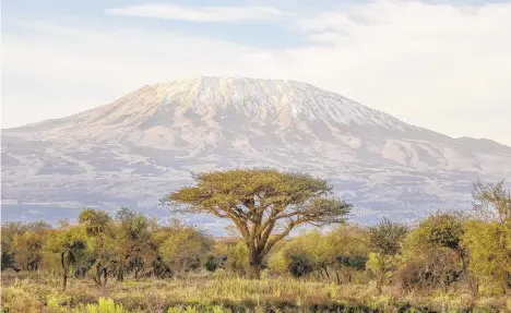  ?? GETTY IMAGES/VETTA FILE PHOTO ?? Mount Kilimanjar­o, an extinct volcano, is the highest point in Africa, reaching 19,341 feet above sea level. Ryan Baki says his biggest concern about his upcoming ascent of the mountain is altitude sickness.