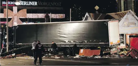  ?? AP ?? A Christmas market outside Berlin’s Kaiser Wilhelm Memorial Church was packed with people when a large truck hurtled into it.