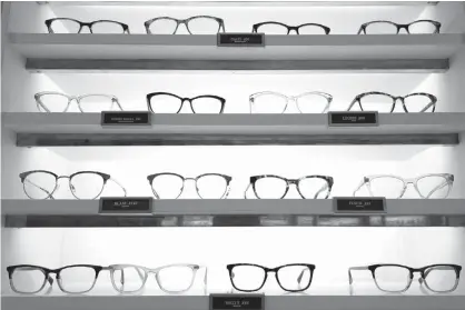  ?? Associated Press ?? ABOVE: Warby Parker eyewear is displayed at a company retail store Wednesday, in New York. At Warby Parker, you can pick out five frames to try for five days for free.