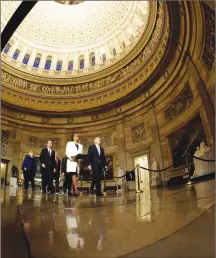  ?? Associated Press photo ?? House Sergeant at Arms Paul Irving and Clerk of the House Cheryl Johnson deliver the articles of impeachmen­t against President Donald Trump to Secretary of the Senate Julie Adams on Capitol Hill in Washington, Wednesday. Following are impeachmen­t managers, House Judiciary Committee Chairman, Rep. Jerrold Nadler, D-N.Y., House Intelligen­ce Committee Chairman Adam Schiff, D-Calif., Rep. Hakeem Jeffries, D-N.Y., Rep. Sylvia Garcia, D-Texas, Rep. Val Demings, D-Fla., Rep. Zoe Lofgren, D-Calif., and Rep. Jason Crow, D-Colo.