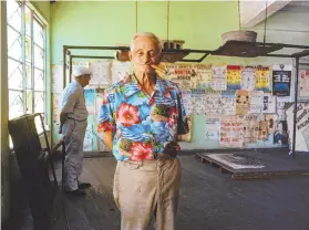  ?? COURTESY OF PHOTO-EYE ?? A 1981 photograph of Sully Emmett, a boxing trainer at the 5th Street Gym in Miami. The historic gym, known for being a training location for Muhammad Ali, was one of then-National Geographic photograph­er Nathan Benn’s favorite places to shoot.