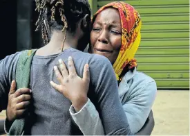  ?? Picture: AFP ?? A woman breaks down after identifyin­g the body of a loved one who died in an attack on a hotel and office complex that claimed at least 21 lives in Nairobi, Kenya, on Tuesday.