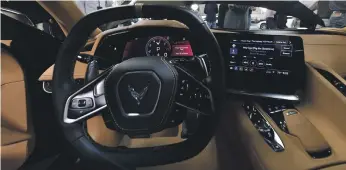  ??  ?? The reconfigur­ed dashboard of the new 2020 mid-engine C8 Corvette Stingray. GM president Mark Reuss reveals the new-look model in California last week, above