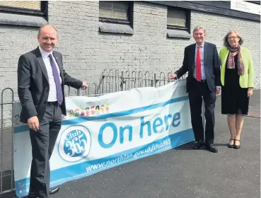  ??  ?? Long-term goal Ms Smith, with North Lanarkshir­e education convener Frank Mcnally (left) and former Scottish Labour leader Richard Leonard visiting the Club 365 food project in 2018