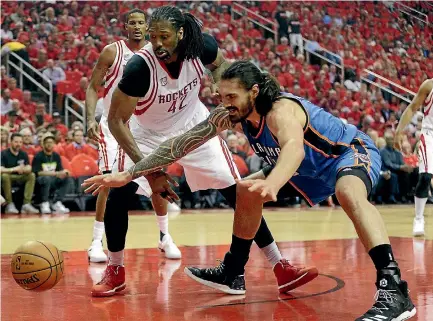  ?? USA TODAY SPORTS ?? Houston Rockets centre Nene Hilario (42) and Oklahoma City Thunder forward Steven Adams (24) reach for a loose ball in the first quarter of game five of the first round of the NBA Playoffs at Toyota Center yesterday.