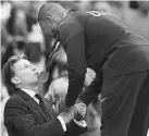  ??  ?? Justin Gatlin receives his medal Sebastian Coe on the podium during the victory ceremony for the men’s 100m athletics event at the IAAF World Championsh­ips at the London Stadium in London. — AFP photo