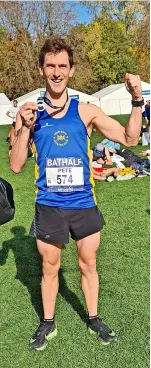  ?? ?? Leading Team Bath runner Pete Dyson with his medal