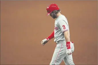  ?? MIKE CARLSON – THE ASSOCIATED PRESS ?? Head down, thoughts of the future swirling, Phillies slugger Bryce Harper isn’t happy after grounding out on his last at-bat of 2020 at Tropicana Field in St. Petersburg, Fla. Harper had interestin­g takes on the Phillies’ pending offseason and the status of general manager Matt Klentak after the game.