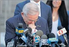  ?? [JULIO CORTEZ/THE ASSOCIATED PRESS] ?? After a mistrial was declared in the federal corruption case against him, Sen. Bob Menendez fights tears as he speaks to reporters outside the Martin Luther King Jr. Federal Courthouse in Newark, N.J.