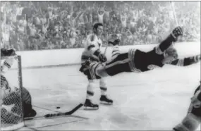  ?? RAY LUSSIER — THE BOSTON HERALD VIA AP, FILE ?? In this file photo, Boston Bruins’ Bobby Orr goes into the air after scoring a goal against the St. Louis Blues that won the Stanley Cup for the Bruins in Boston. As the NHL celebrates its 100th anniversar­y, Orr’Äôs goal is so important that it reached...