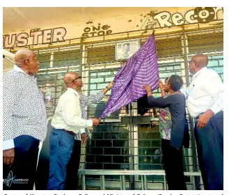  ??  ?? Custos of Kingston Stedman Fuller and Minister of Culture, Gender, Entertaine­nt and Sports, Oliva ‘Babsy’ Grange unveiling a plaque in honour of Prince Buster on Orange Street. Looking on are Colin Leslie, director of Sound and Pressure Foundation (left), and Counsellor Donovan Samuels.