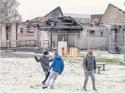  ?? Picture: Wullie Marr. ?? Children outside Cairneyhil­l Primary School, which was gutted by a fire last year.