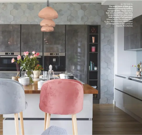  ??  ?? KITCHEN The smart bank of slate grey cabinets is framed by striking hexagonal tiles. ‘These were a last-minute addition,’ says Jess, ‘as we decided the area would look too plain if left painted.’ Milano Infinity Plus kitchen, from £5,830, Wren Kitchens. Amsterdam 3D Hexagon tiles in Grey, price on request, Porcelanos­a