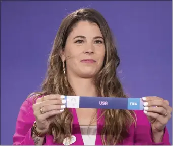  ?? CHRISTOPHE ENA — THE ASSOCIATED PRESS ?? Canadian soccer player Stephanie Labbe draws USA during the draw for the Paris 2024 Olympic Women’s Soccer tournament­s, Wednesday, March 20, 2024 in Saint-Denis, outside Paris.