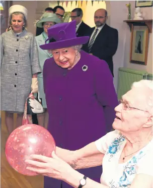  ?? Picture: EAMONN M MCCORMACK/GETTY ?? The Queen watches keep-fit enthusiast­s at a day centre in Windsor yesterday