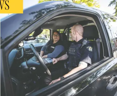  ?? DARRYL DYCK/THE CANADIAN PRESS ?? Psychiatri­c nurse Tina Baker, left, and Surrey RCMP Cpl. Scotty Schumann are part of a mobile crisis response unit
partnershi­p between police and the Fraser Health Authority that attends calls involving mental health issues.