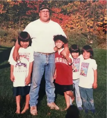  ?? FAMILY PHOTOS ?? Foster father Joe Curotte, centre, with Pierre Gregoire, left, Iohseri:io, in red, Lisa (Watshennon:ni) and Iohahi:io.