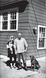  ??  ?? MATT AND MEGAN KLEPP stand in front of their accessory dwelling unit in Portland, Ore. At right, the space between the Klepps’ main house and the accessory dwelling unit features a fire pit and seating.