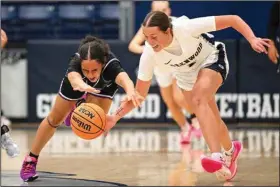  ?? (River Valley Democrat-Gazette/Caleb Grieger) ?? Greenwood senior Brooklyn Woolsey and Fayettevil­le senior Whitney Brown dive for the ball Nov. 16, 2023, at the H.B. Stewart Arena in Greenwood.