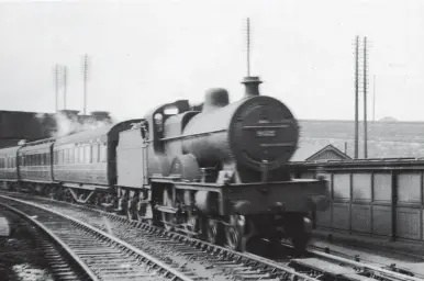  ?? Steam Days would like to thank Mrs Sheila Dennis for allowing us to use the album of photograph­s taken by her father. ?? LMS Vulcan Foundry-built Compound No 932 runs under the Carleton New Road overbridge and past Skipton North signal box as it enters the station on Saturday, 20 September 1930 while in charge of the up ‘Thames-Clyde Express’ and running non-stop to Leeds. To the right of the locomotive is part of the underpass that linked the platforms at Skipton and is still in use today. Once past Bell Busk, up trains generally have gradients in their favour, apart from short climbs to Keighley and Armley, but congestion on the Aire Valley lines usually precluded any fast running when trying to recover time from delays experience­d earlier in the journey from Carlisle.