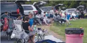  ?? AFP ?? People attend a drive- in movie screening at Family Drive- in in Stephens City, Virginia, on August 10. —