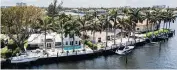  ?? MATIAS J. OCNER mocner@miamiheral­d.com ?? Aerial view of single-family homes off Lake Santa Barbara in Pompano Beach.