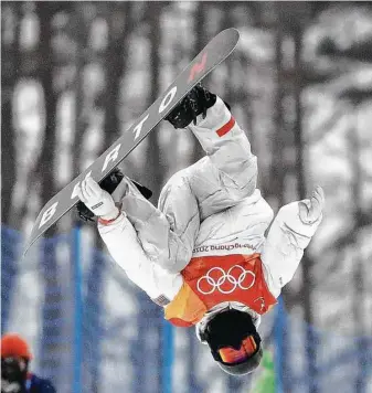  ?? Gregory Bull / Associated Press ?? Shaun White’s world was upside down when he failed to medal at Sochi in 2014. The same could be said, but in a good way, during Wednesday’s halfpipe finals at Phoenix Snow Park.