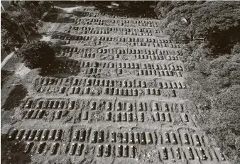  ?? Andre Penner / Associated Press ?? The graves of the recently buried fill Vila Formosa cemetery in Sao Paulo. Brazil is emerging as Latin America’s coronaviru­s epicenter with more than 6,000 deaths.