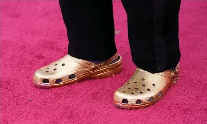  ?? Photograph: Chris Pizzello/AFP/Getty Images ?? Questlove arrives at the Oscars on Sunday in a pair of gold crocs.