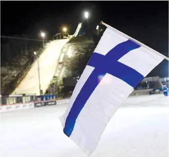  ?? (Reuters) ?? THE FLAG of Finland flies at a sports event.