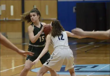  ??  ?? Cam Wilders looks for an open teammate on January 17as Shen cruised to the 66-33win at Columbia High School.