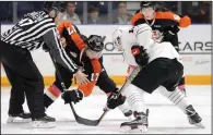  ?? NEWS PHOTO RYAN MCCRACKEN ?? Medicine Hat Tigers centre Logan Christense­n (17) battles for a faceoff with Daniil Stepanov of the Moose Jaw Warriors during the first period of Saturday’s Western Hockey League game at the Canalta Centre.