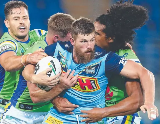  ?? Picture: GETTY IMAGES ?? Will Matthews puts his injury woes behind him during the Round 1 match between the Titans and Canberra.