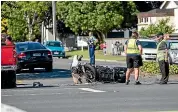  ?? TOM LEE/STUFF ?? A car and motorbike collided on Ulster St in Hamilton on Tuesday, with the rider taken to hospital in a serious condition.