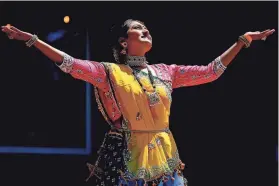  ?? BRYAN TERRY/THE OKLAHOMAN ?? Nishita Shah, founder and artistic director of the Nritya-Arpan Dance School in Edmond, performs a folk dance during the Indian Associatio­n of Oklahoma’s 2022 Holi Festival of Colors in Logan County.