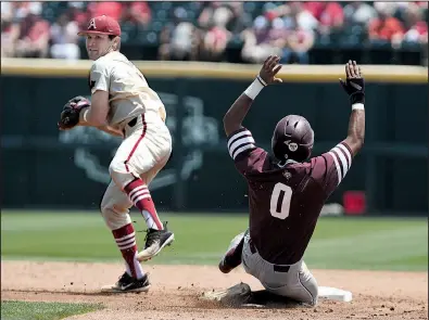  ?? NWA Democrat-Gazette/J.T. WAMPLER ?? to first for a double play after catching Texas A&M’s Allonte Wingate at second on Sunday at Baum Stadium in Fayettevil­le. It was one of two double plays Kenley helped the Razorbacks turn as he filled in for Jax Biggers at shortstop.